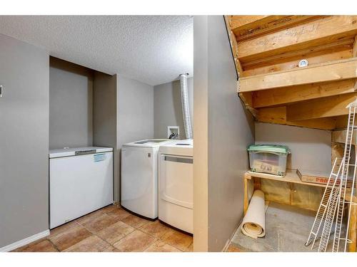 9 Cimarron Grove Drive, Okotoks, AB - Indoor Photo Showing Laundry Room