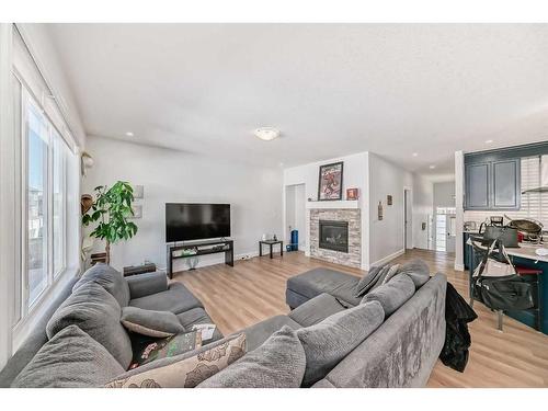 270 Carringham Road Nw, Calgary, AB - Indoor Photo Showing Living Room With Fireplace