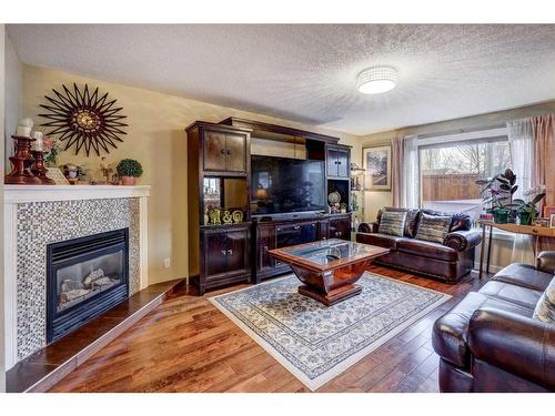 117 Coventry Mews Ne, Calgary, AB - Indoor Photo Showing Living Room With Fireplace