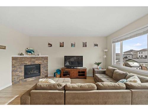 41 Hanson Lane Ne, Langdon, AB - Indoor Photo Showing Living Room With Fireplace