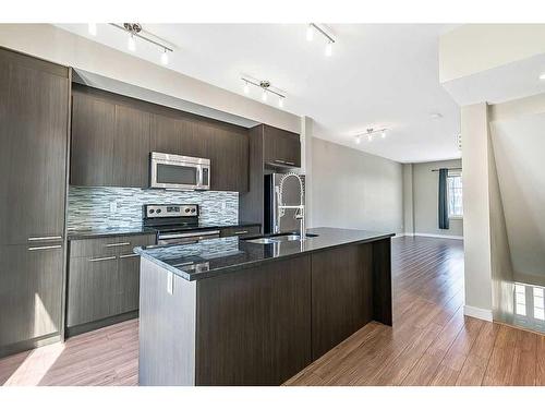 64-300 Marina Drive, Chestermere, AB - Indoor Photo Showing Kitchen With Upgraded Kitchen