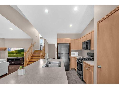 273 Panatella Boulevard Nw, Calgary, AB - Indoor Photo Showing Kitchen With Double Sink