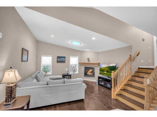 273 Panatella Boulevard Nw, Calgary, AB - Indoor Photo Showing Living Room With Fireplace