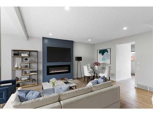 256 Whiteridge Place Ne, Calgary, AB - Indoor Photo Showing Living Room With Fireplace