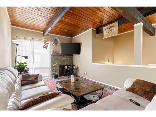 107 Pinemont Bay Ne, Calgary, AB - Indoor Photo Showing Living Room With Fireplace