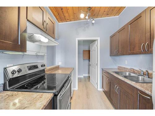 C-1427 43 Street Se, Calgary, AB - Indoor Photo Showing Kitchen With Double Sink