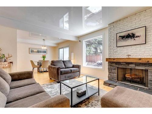 933 Ranchview Crescent Nw, Calgary, AB - Indoor Photo Showing Living Room With Fireplace