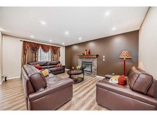 15 Everwoods Green Sw, Calgary, AB - Indoor With Fireplace