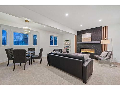 438 Rocky Ridge Cove Nw, Calgary, AB - Indoor With Fireplace