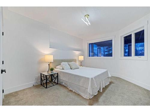 438 Rocky Ridge Cove Nw, Calgary, AB - Indoor Photo Showing Bedroom