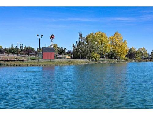 438 Rocky Ridge Cove Nw, Calgary, AB - Outdoor With Body Of Water With View