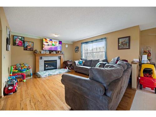 28 Coral Springs Close Ne, Calgary, AB - Indoor Photo Showing Living Room With Fireplace