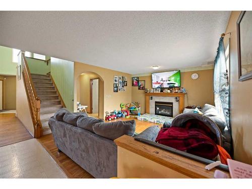 28 Coral Springs Close Ne, Calgary, AB - Indoor Photo Showing Living Room With Fireplace