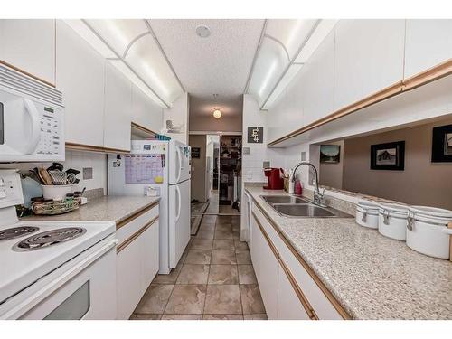 411-55 Arbour Grove Close Nw, Calgary, AB - Indoor Photo Showing Kitchen With Double Sink