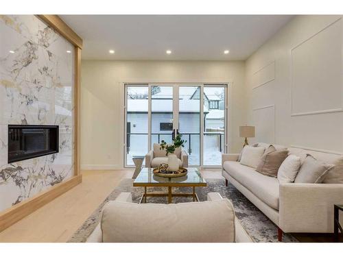 235 11A Street Nw, Calgary, AB - Indoor Photo Showing Living Room With Fireplace