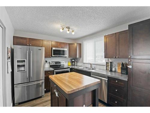719 Whitehill Way Ne, Calgary, AB - Indoor Photo Showing Kitchen With Stainless Steel Kitchen With Double Sink