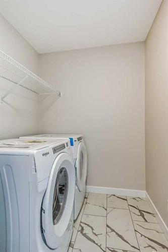 251 Belvedere Drive Se, Calgary, AB - Indoor Photo Showing Laundry Room