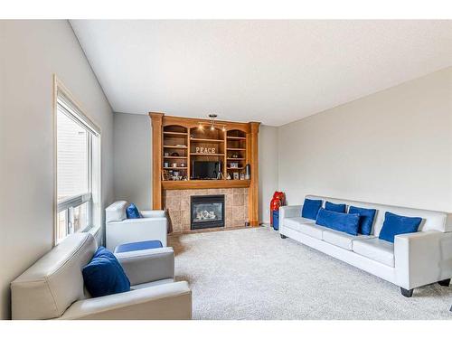 340 Crimson Close, Chestermere, AB - Indoor Photo Showing Living Room With Fireplace