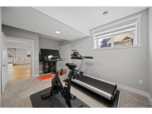 286 Coopers Cove Sw, Airdrie, AB - Indoor Photo Showing Gym Room