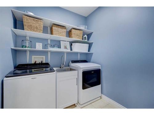215 Gleneagles View, Cochrane, AB - Indoor Photo Showing Laundry Room