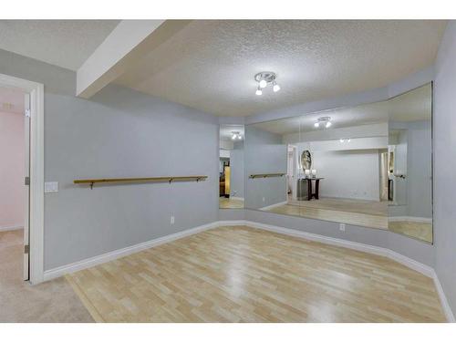 215 Gleneagles View, Cochrane, AB - Indoor Photo Showing Other Room
