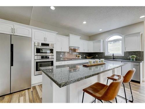 215 Gleneagles View, Cochrane, AB - Indoor Photo Showing Kitchen With Stainless Steel Kitchen With Upgraded Kitchen