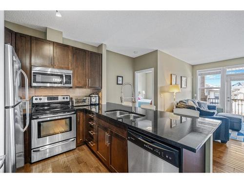 309-22 Panatella Road Nw, Calgary, AB - Indoor Photo Showing Kitchen With Double Sink