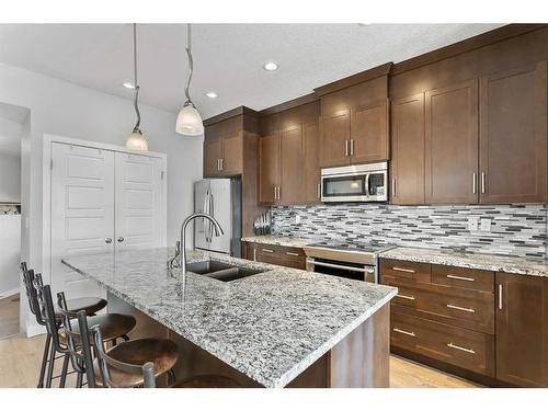 467 Seclusion Valley Drive, Diamond Valley, AB - Indoor Photo Showing Kitchen With Double Sink With Upgraded Kitchen