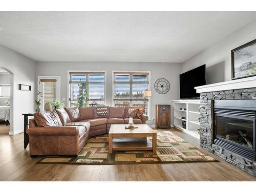 467 Seclusion Valley Drive, Diamond Valley, AB - Indoor Photo Showing Living Room With Fireplace