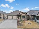 467 Seclusion Valley Drive, Diamond Valley, AB  - Outdoor With Facade 
