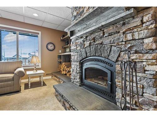 467 Seclusion Valley Drive, Diamond Valley, AB - Indoor Photo Showing Living Room With Fireplace