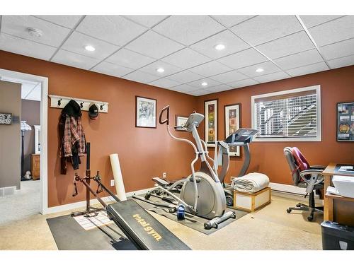 467 Seclusion Valley Drive, Diamond Valley, AB - Indoor Photo Showing Gym Room