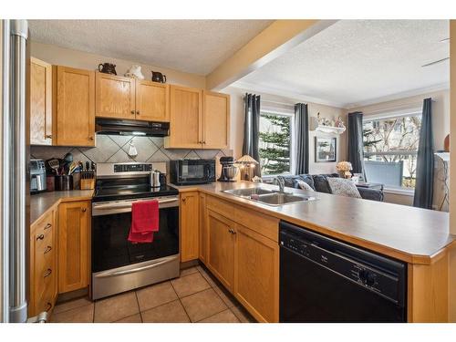 82 Eversyde Court Sw, Calgary, AB - Indoor Photo Showing Kitchen With Double Sink