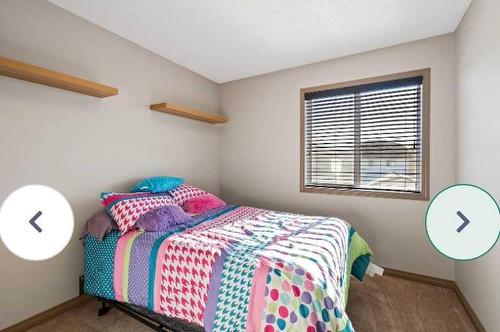 1819 New Brighton Drive Se, Calgary, AB - Indoor Photo Showing Bedroom