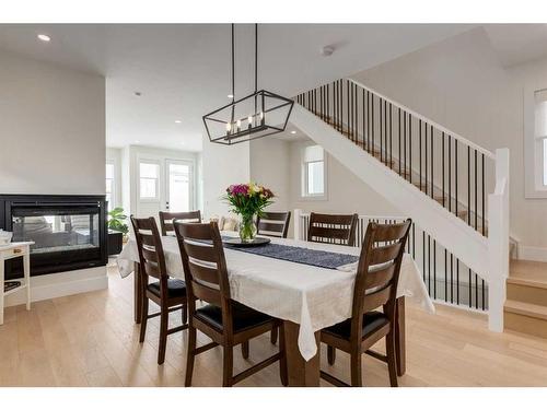 1637 23 Avenue Nw, Calgary, AB - Indoor Photo Showing Dining Room With Fireplace