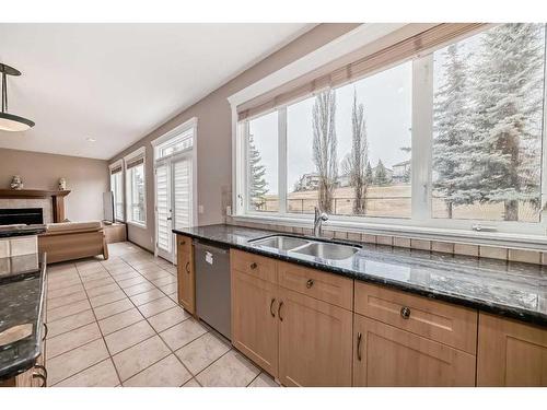 55 Panorama Hills Point Nw, Calgary, AB - Indoor Photo Showing Kitchen With Fireplace With Double Sink