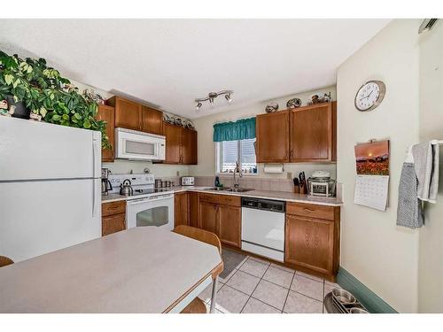 71 Taradale Drive Ne, Calgary, AB - Indoor Photo Showing Kitchen With Double Sink