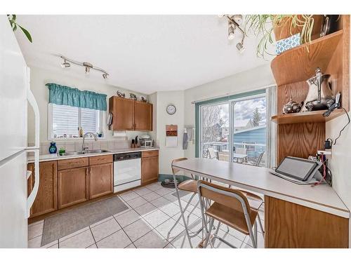 71 Taradale Drive Ne, Calgary, AB - Indoor Photo Showing Kitchen With Double Sink