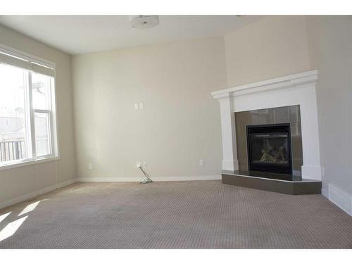 1217 Brightoncrest Common Se, Calgary, AB - Indoor Photo Showing Living Room With Fireplace