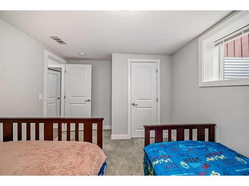 155 Penbrooke Close Se, Calgary, AB - Indoor Photo Showing Bedroom