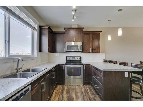 1569 Symons Valley Parkway Nw, Calgary, AB - Indoor Photo Showing Kitchen With Stainless Steel Kitchen With Double Sink