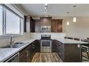 1569 Symons Valley Parkway Nw, Calgary, AB  - Indoor Photo Showing Kitchen With Stainless Steel Kitchen With Double Sink 