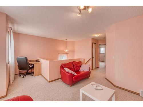 160 Eversyde Circle Sw, Calgary, AB - Indoor Photo Showing Living Room