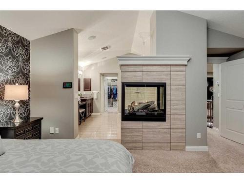 123 Mahogany Bay Se, Calgary, AB - Indoor Photo Showing Bedroom With Fireplace