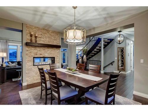 123 Mahogany Bay Se, Calgary, AB - Indoor Photo Showing Dining Room With Fireplace