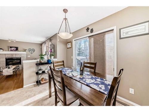 13725 Mt Mckenzie Drive Se, Calgary, AB - Indoor Photo Showing Dining Room With Fireplace