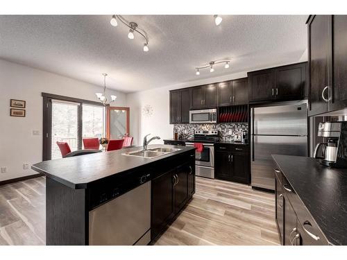 263 Silverado Plains Close Sw, Calgary, AB - Indoor Photo Showing Kitchen With Stainless Steel Kitchen With Double Sink