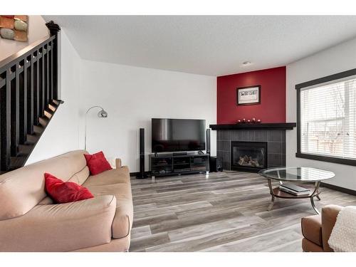 263 Silverado Plains Close Sw, Calgary, AB - Indoor Photo Showing Living Room With Fireplace