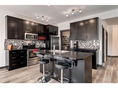 263 Silverado Plains Close Sw, Calgary, AB - Indoor Photo Showing Kitchen With Stainless Steel Kitchen With Double Sink With Upgraded Kitchen