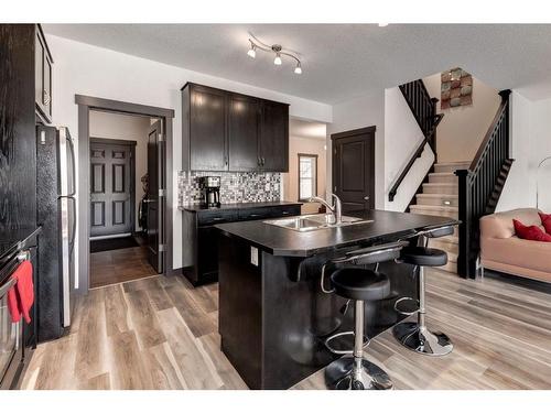 263 Silverado Plains Close Sw, Calgary, AB - Indoor Photo Showing Kitchen With Double Sink